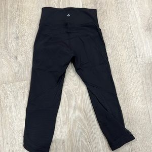 Lululemon cropped leggings. Sheer dotted details on back and bottoms. Size 4